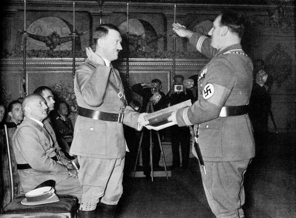 Nuremberg's mayor Willy Liebel presents Adolf Hitler with the honorary gift of the city of the Party rallies, a valuable hand-colored document Nuremberg's mayor Willy Liebel presents Adolf Hitler with the honorary gift of the city of the Party rallies, a valuable hand-colored document